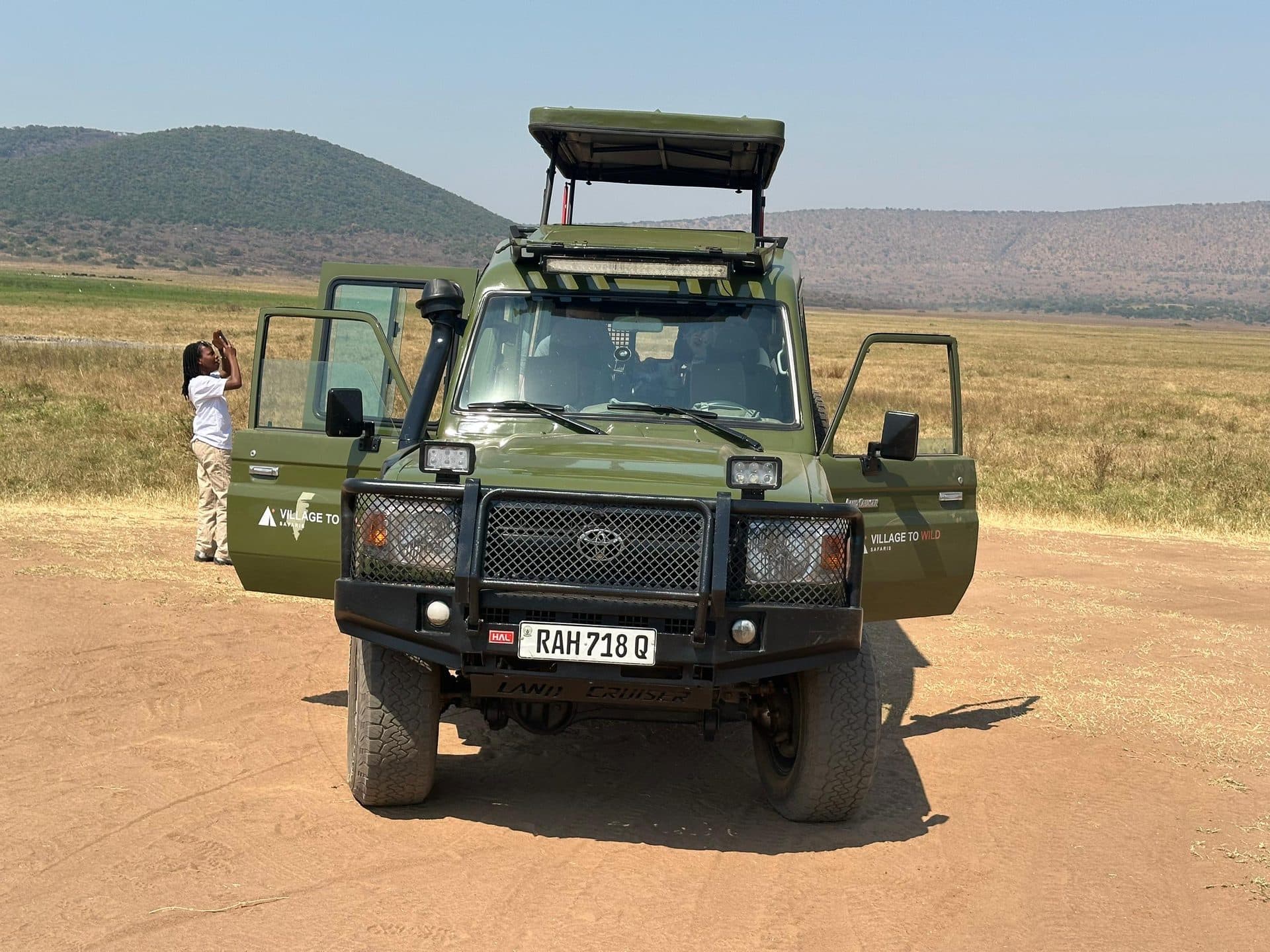 Village to Wild Safaris travelers on safari in Rwanda
