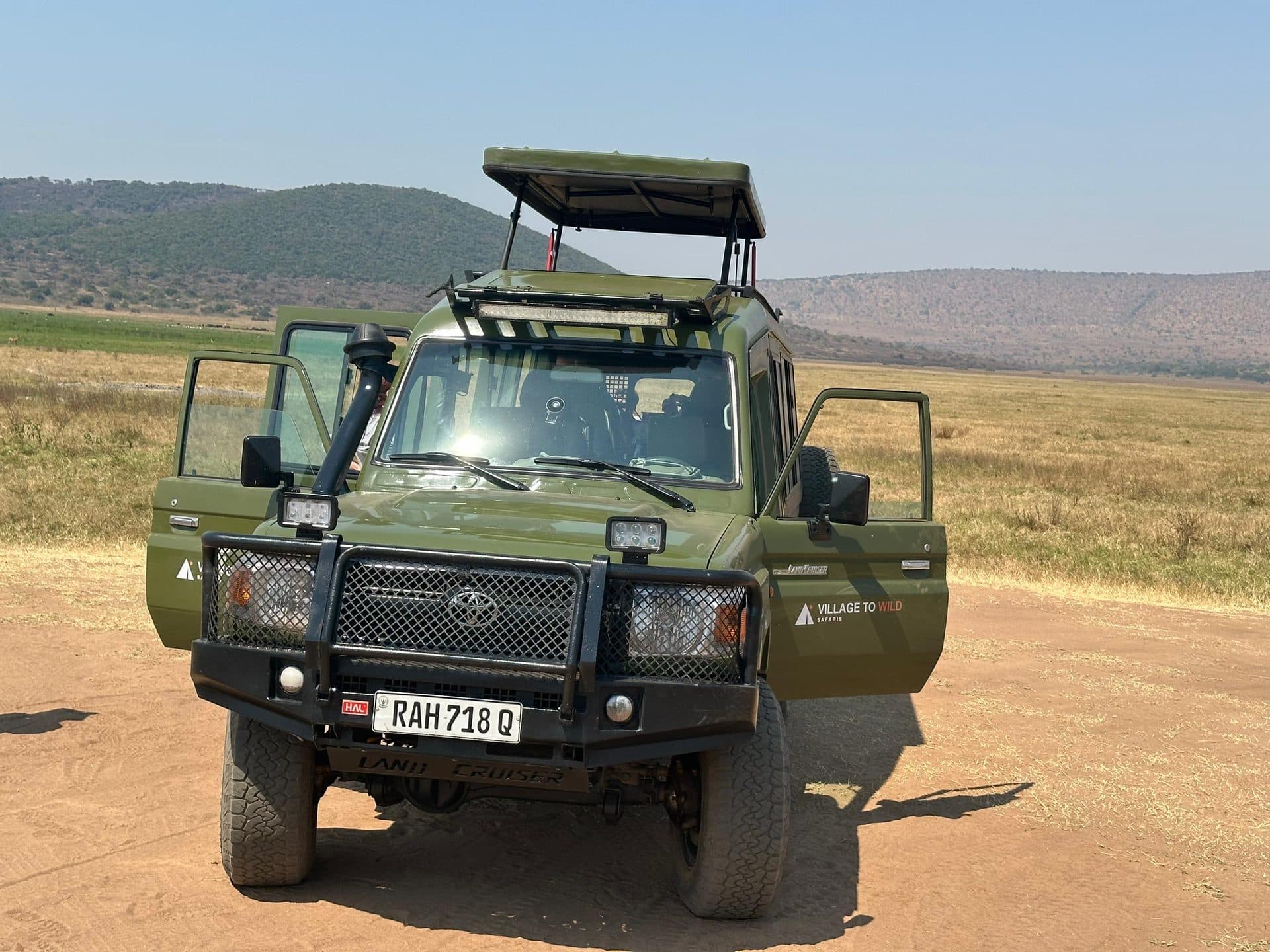 Village to Wild Safaris travelers on safari in Rwanda