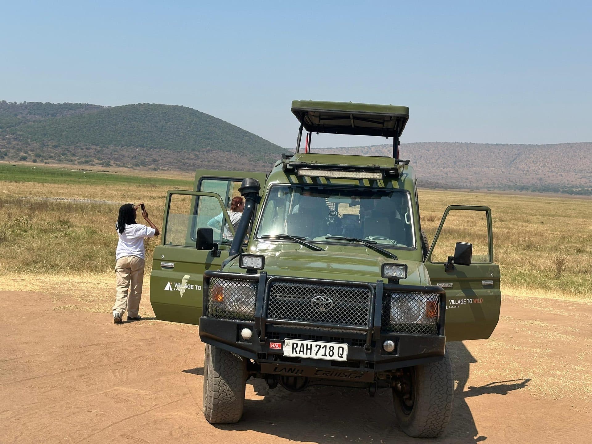 Village to Wild Safaris travelers on safari in Rwanda